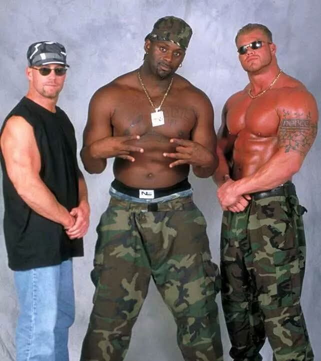 Big Swoll with fellow professional wrestlers