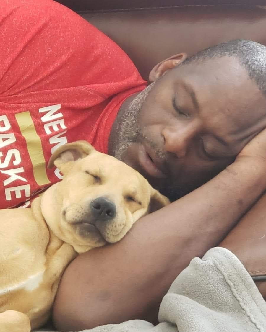 Randy Thornton resting with his dog